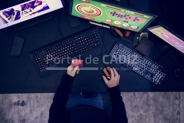 hand holding credit card playing online gambling pkpr7af
