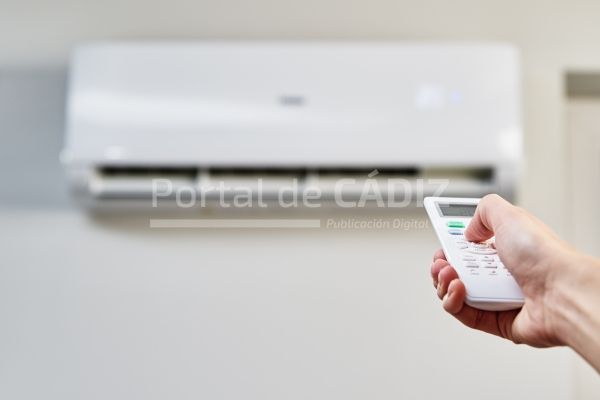 hand adjusting temperature on air conditioner 2022 01 24 20 29 14 utc