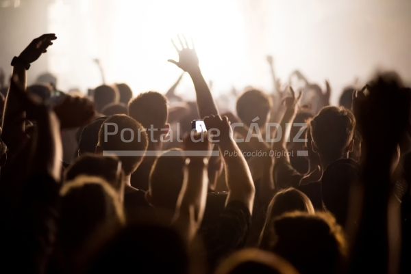 rear view of festival crowd raising their hands 2022 08 11 03 00 58 utc