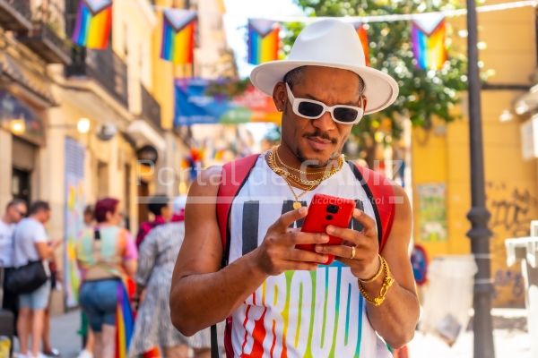 a gay black man at the pride party writing a messa 2022 08 04 23 55 00 utc