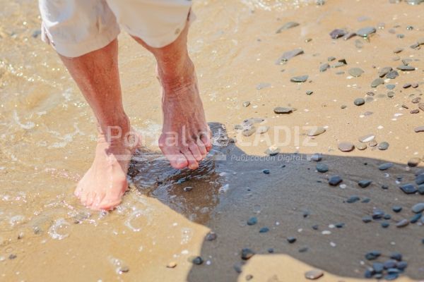 elderly woman s feet walking on the sand on the be 2022 07 02 00 12 36 utc