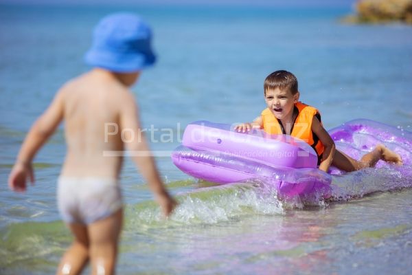 young boys playing with floating air mattress 2021 08 26 22 40 15 utc