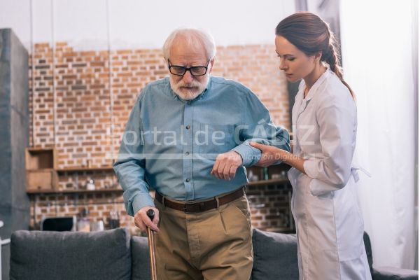 doctor helping elder male patient with cane 2022 11 03 03 30 58 utc