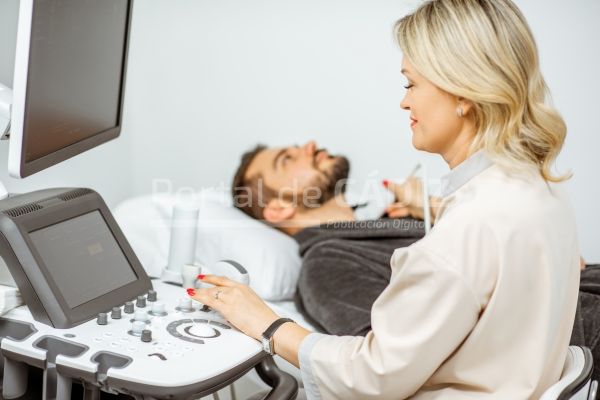 doctor examining men 39 s thyroid with ultrasound 2022 01 18 23 54 14 utc