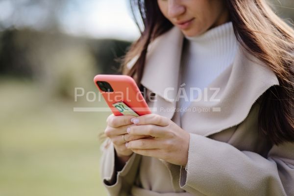smiling woman using smartphone and holding money f 2021 09 02 07 15 29 utc
