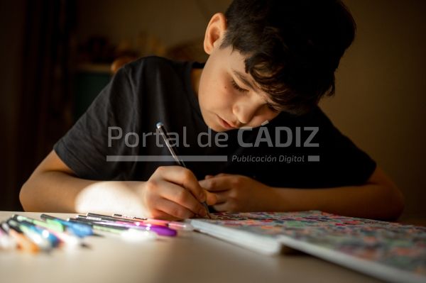 a teenager sits at the table and paints antistress 2022 11 15 08 05 24 utc