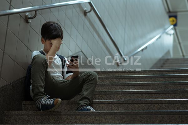 young asian boy sit on stairs alone hold smartpho 2022 10 06 02 02 36 utc